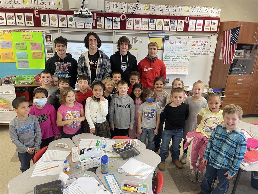 BHS senior football players with first-graders